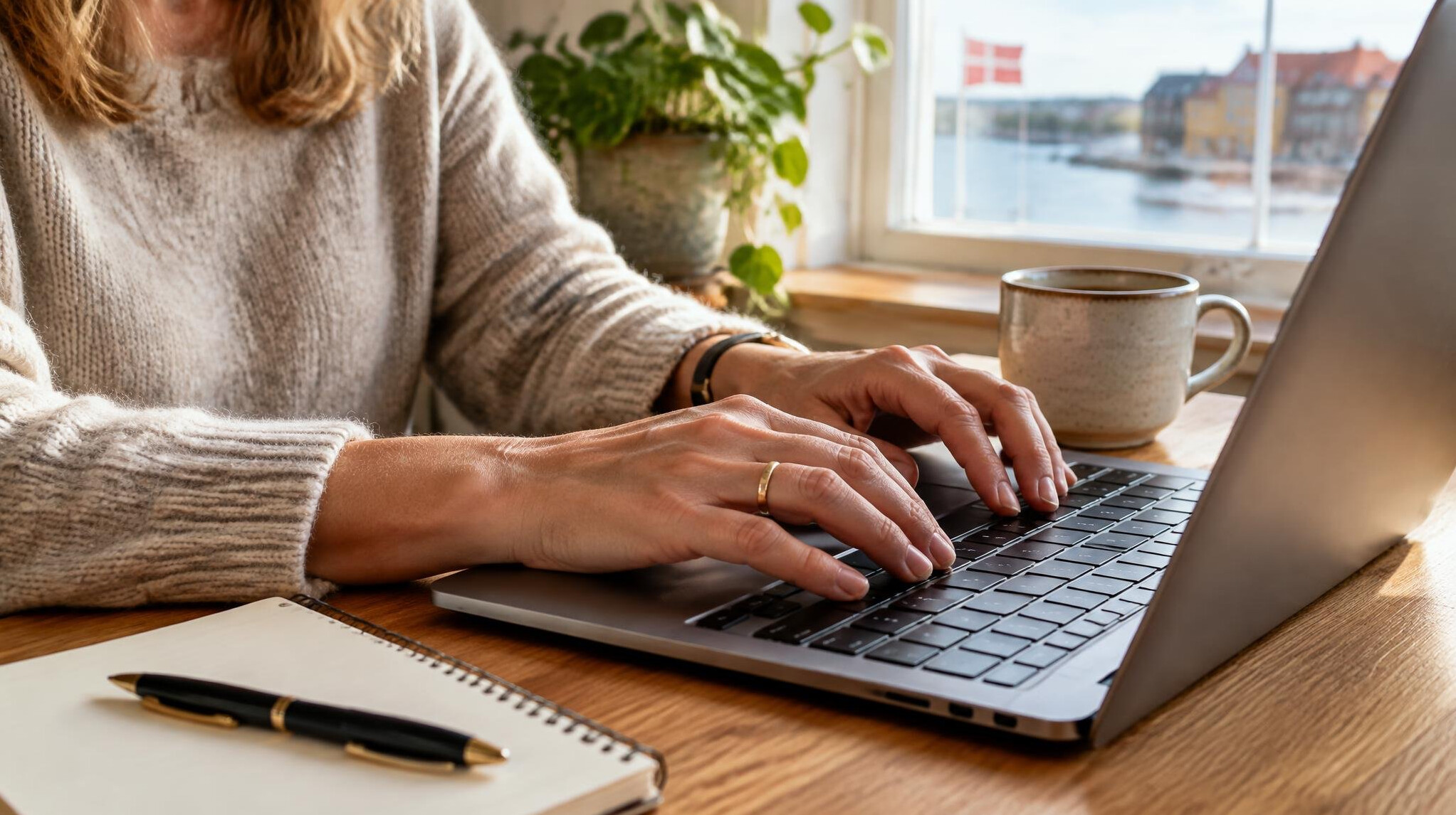 Hands typing on a laptop while writing a personal story