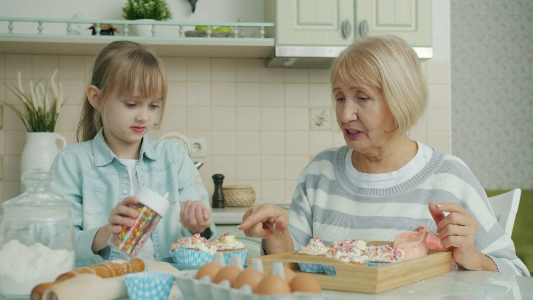 grandmother baking with grandchildren