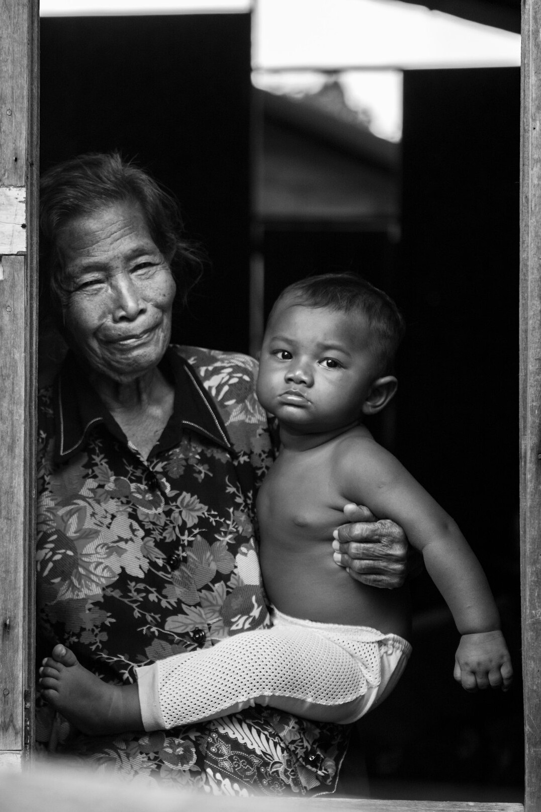 elderly woman with grandchildren