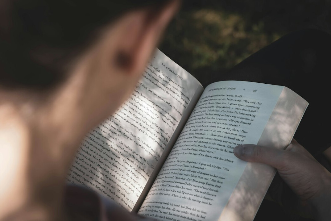 student reading book quietly